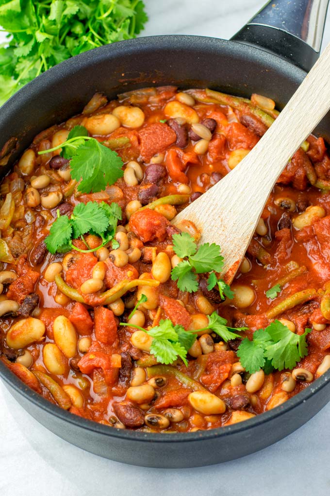 These homemade Ranch Style Beans are are made with four kinds of beans to create the perfect texture. Super easy to make in one pot, crockpot ready, and seriously so easy plus delicious! Naturally vegan, gluten free once you've tried it, you want coming back for in no time. A keeper that the whole family will love, even the pickiest kids.