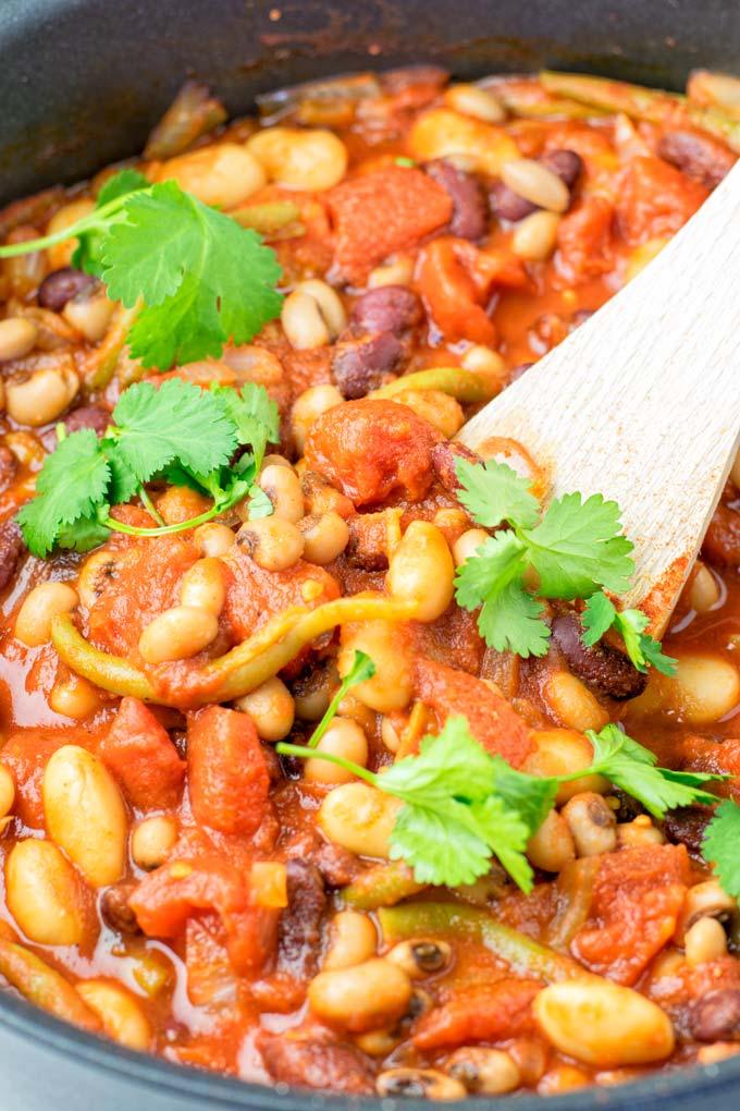 These homemade Ranch Style Beans are are made with four kinds of beans to create the perfect texture. Super easy to make in one pot, crockpot ready, and seriously so easy plus delicious! Naturally vegan, gluten free once you've tried it, you want coming back for in no time. A keeper that the whole family will love, even the pickiest kids.