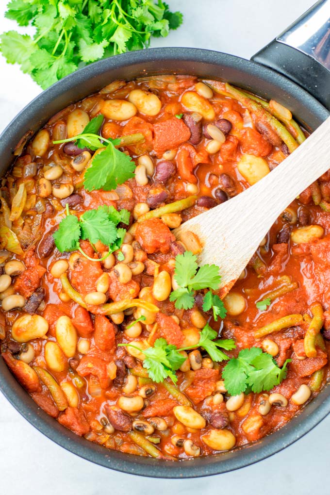 These homemade Ranch Style Beans are are made with four kinds of beans to create the perfect texture. Super easy to make in one pot, crockpot ready, and seriously so easy plus delicious! Naturally vegan, gluten free once you've tried it, you want coming back for in no time. A keeper that the whole family will love, even the pickiest kids.