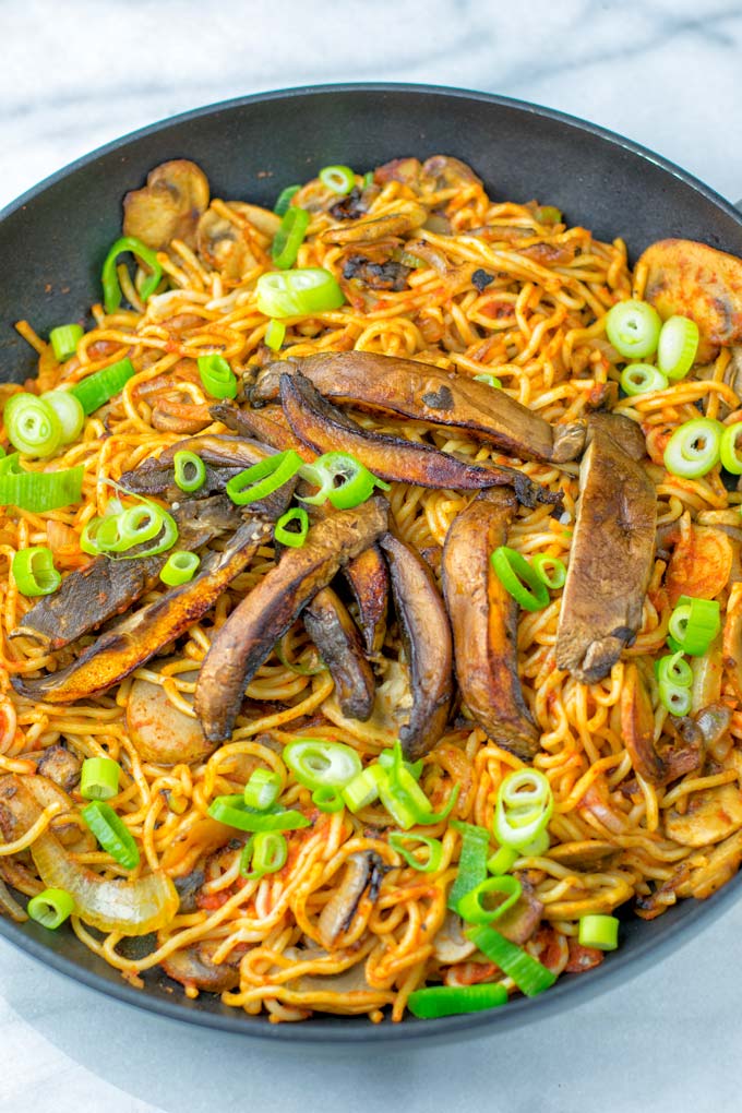 Wok noodles, mushrooms, onions, and green onions are needed.