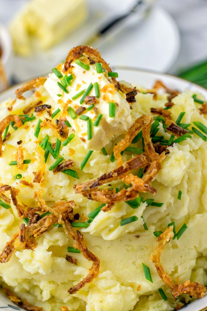 Creamy and so flavorful, these Garlic Mashed Potatoes should be on every holiday table.