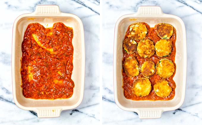 Showing the first steps in the assembly of the Zucchini Parmesan: tomato sauce is spread on the bottom of a casserole dish, followed by a layer of fried zucchini.