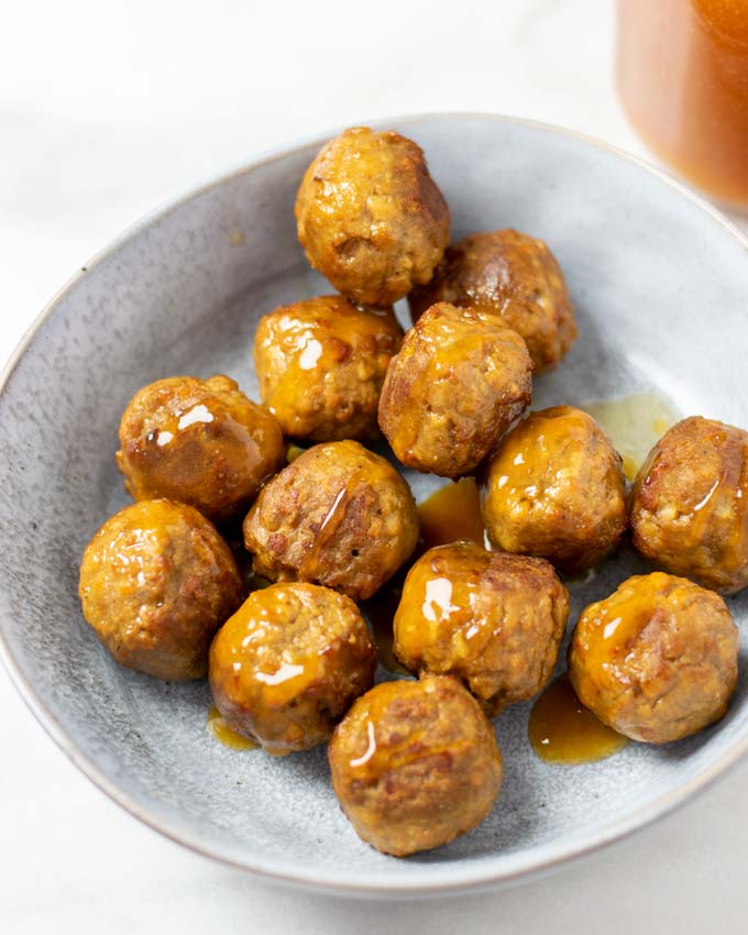 A portion of vegan meatballs covered in Hawaiian Sauce.