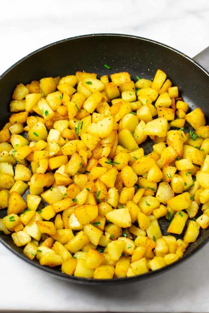 Country Potatoes are garnished with fresh chives.