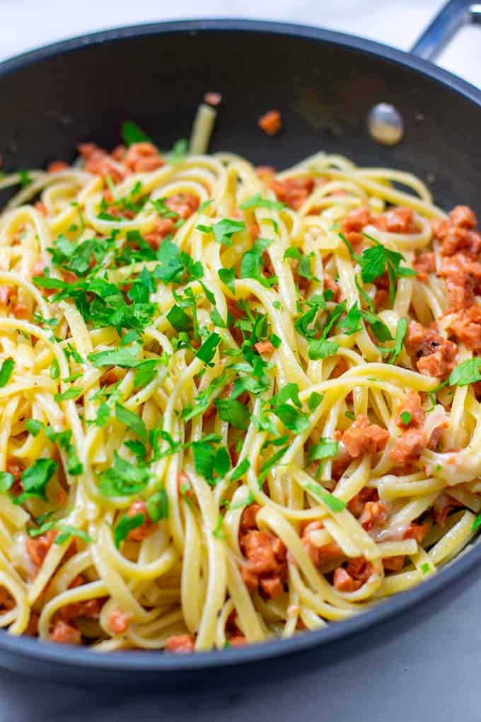 Closeup on the fresh green parsley topping with the linguine.