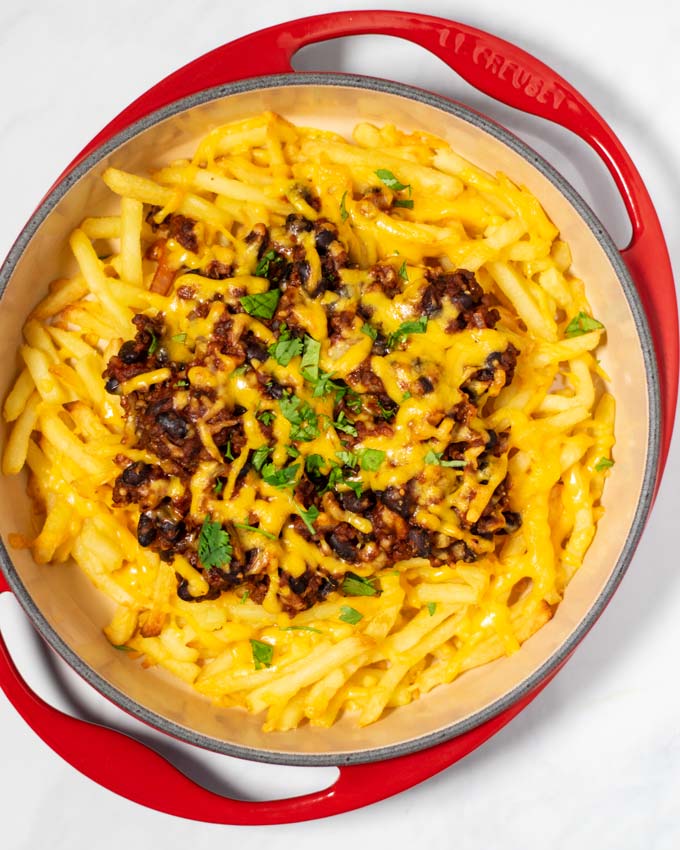 Ready Chili Cheese Fries after baking, garnished with fresh cilantro.