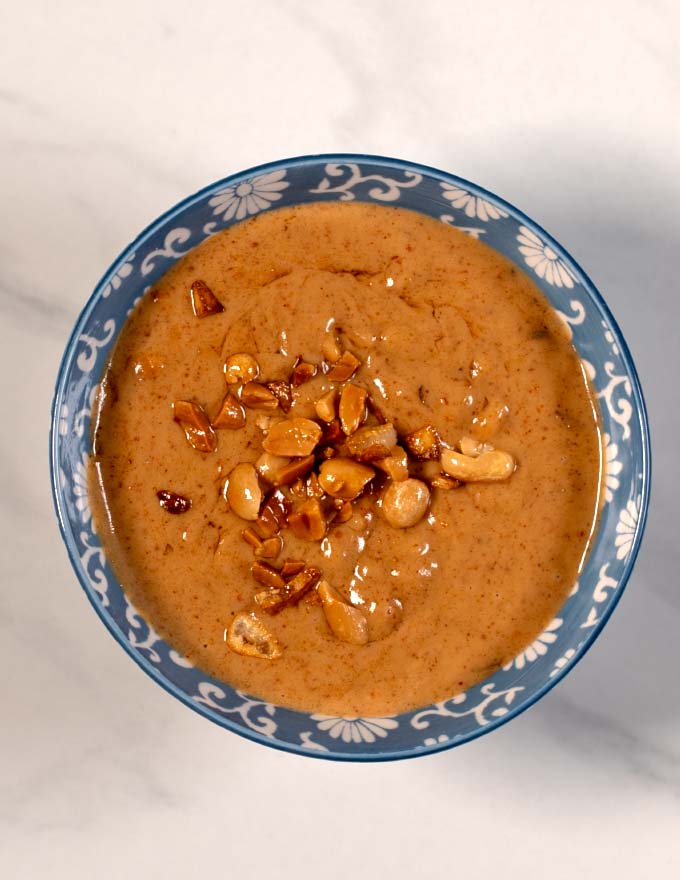 Top view on a serving bowl with Vietnamese Peanut Sauce.