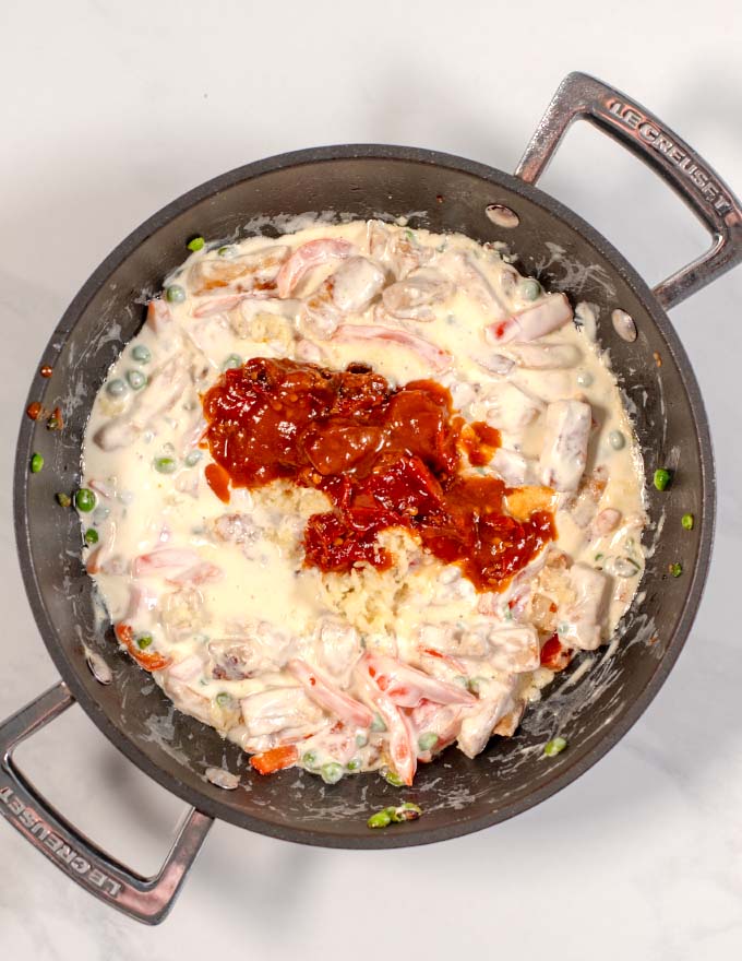 Chipotle peppers with adobo sauce is added to the creamy sauce.