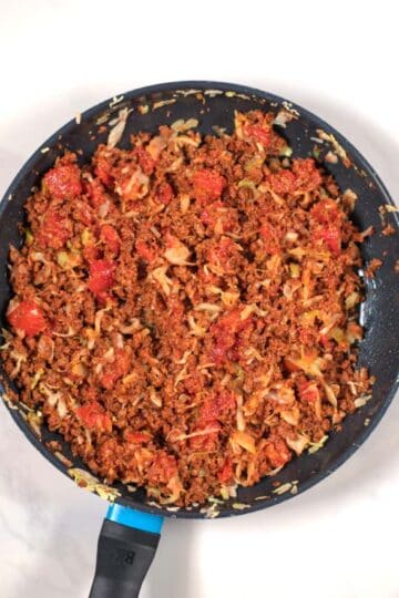 Top view of a pan with Hamburger and Cabbage