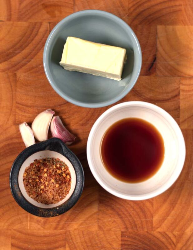 Ingredients needed to make Bloves Sauce collected on a board.