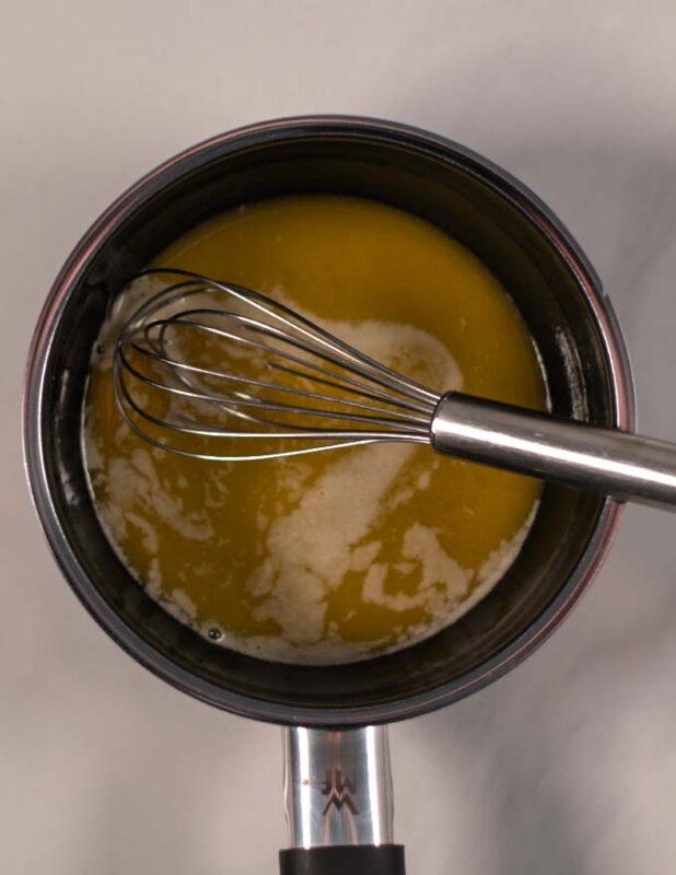 Vegan butter is melted in a saucepan.