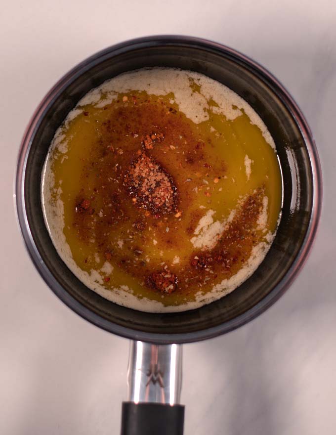 Spices are added to the melted butter.