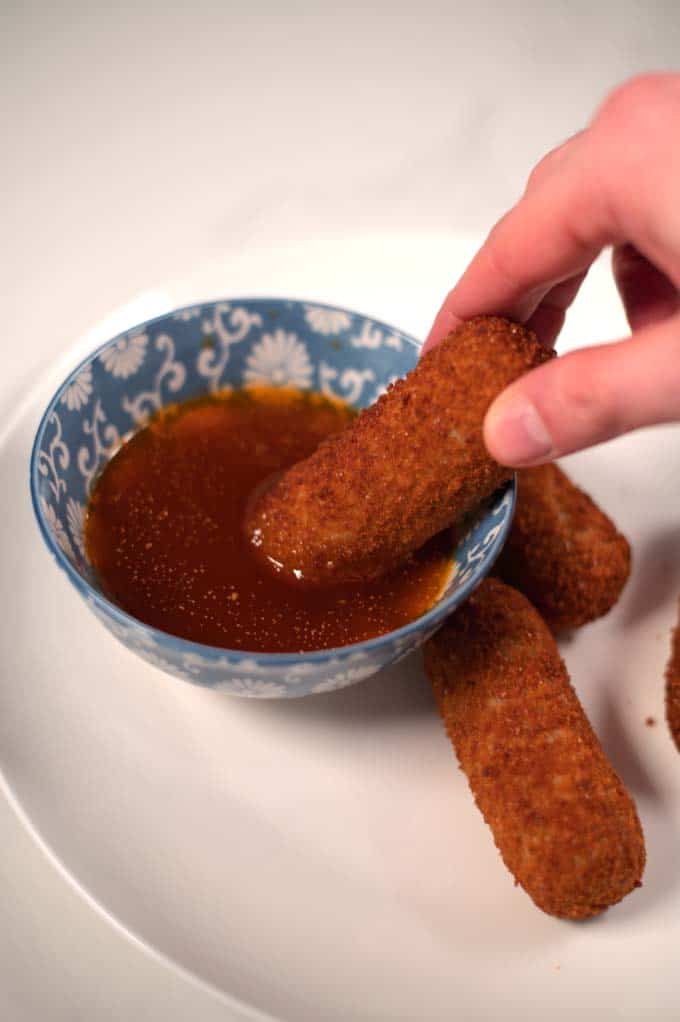 Dipping snacks into Bloves Sauce.