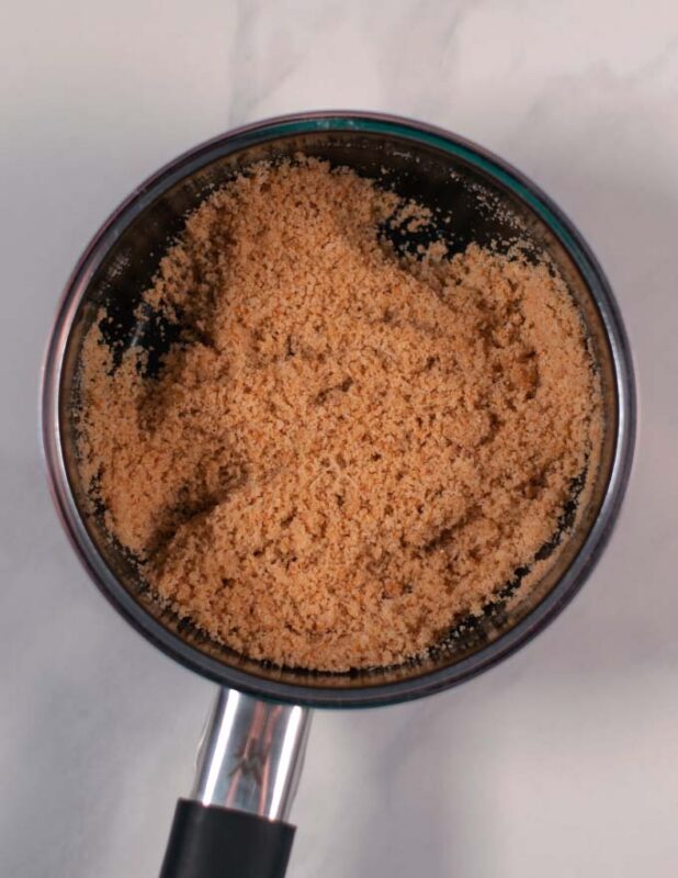 The breadcrumb toppin in a small saucepan.