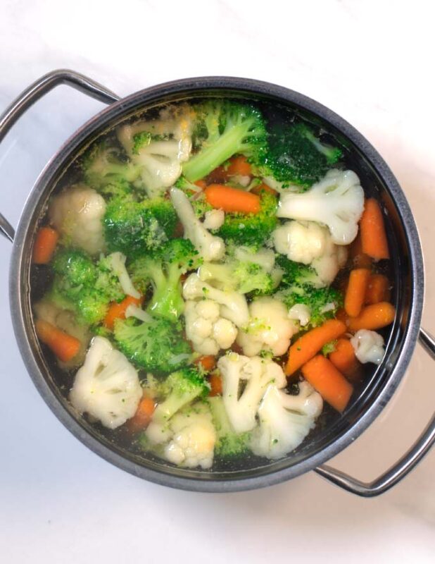 Mixed vegetables are precooked tender in salt water.