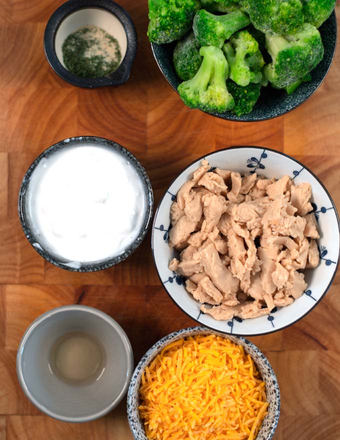 Ingredients needed to make Ranch Chicken Casserole before cooking on a board.