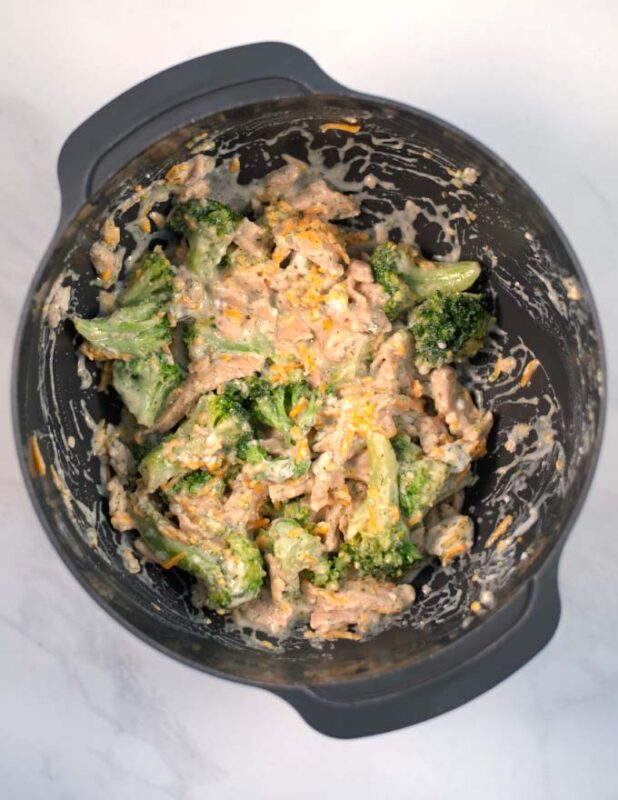 View of a mixing bowl with the mixed Ranch Chicken Casserole.