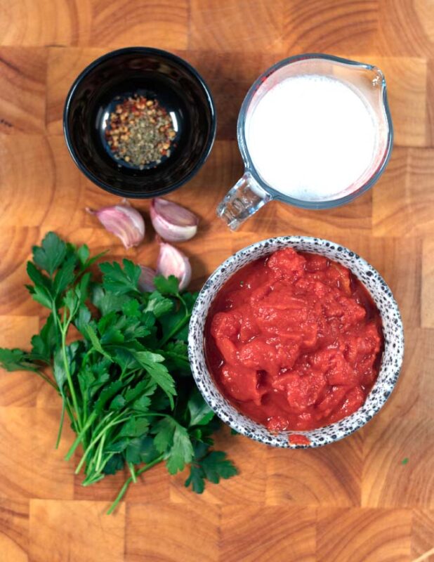 Ingredients needed to make Ravioli Sauce are collected before cooking.