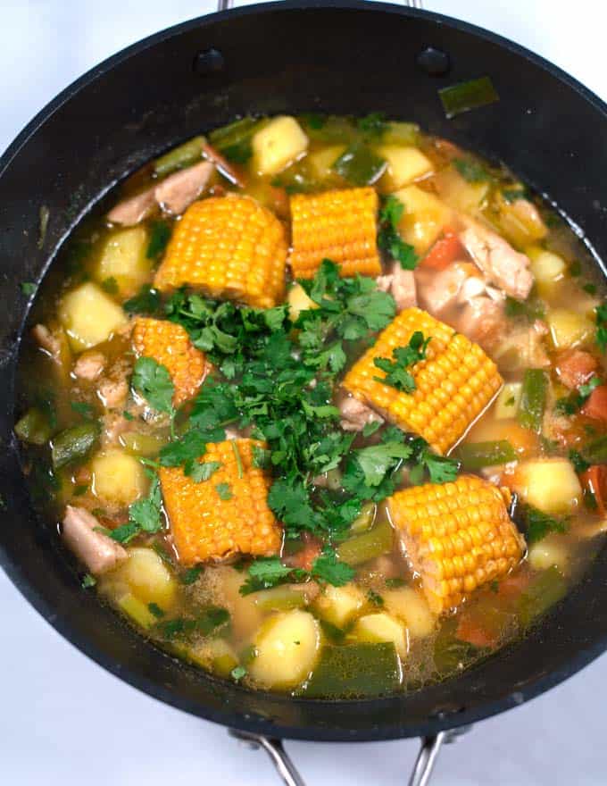 Fresh cilantro is used to garnish Sancocho.