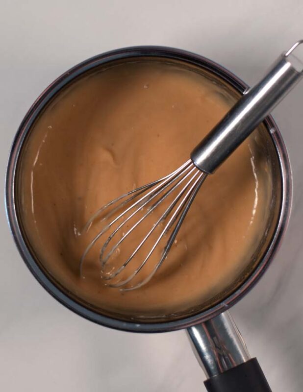 A thick gravy in a saucepan.