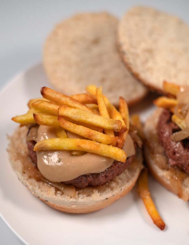 A serving of Hot Hamburgers with fries.