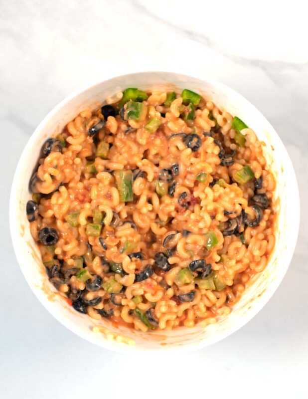 Fully mixed Mexican Macaroni Salad in a white bowl.