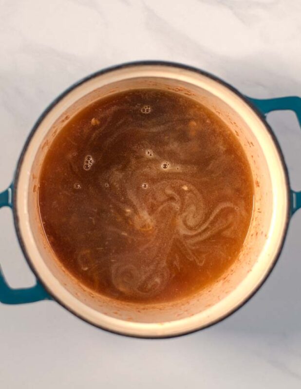 Vegetable broth base in a pot.