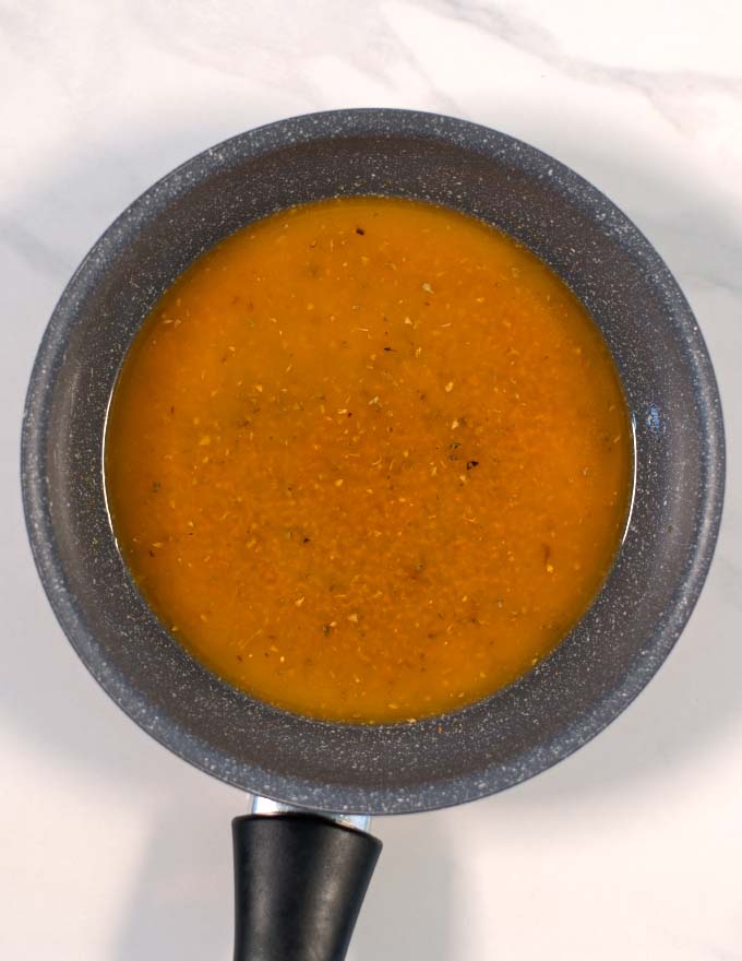 Ready mixed Cajun Garlic Butter Sauce in a pan.