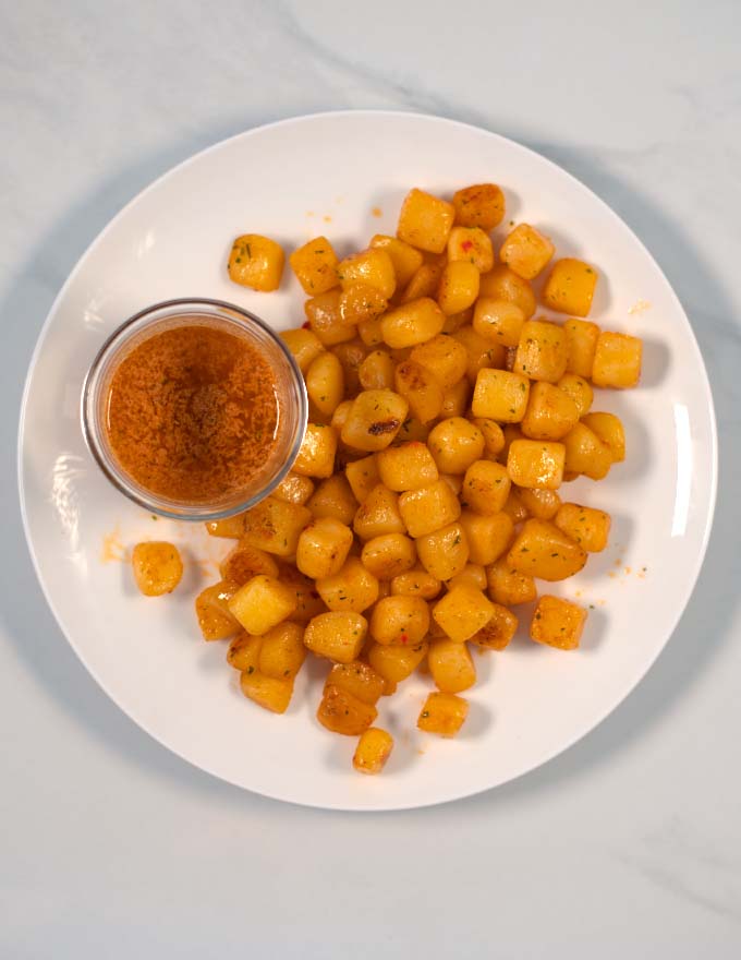 A serving of seasoned potato cubes.