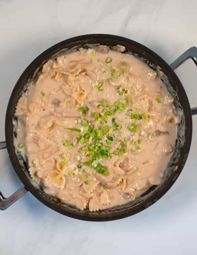 Fresh scallions are used to garnish the ready Cream of Chicken.