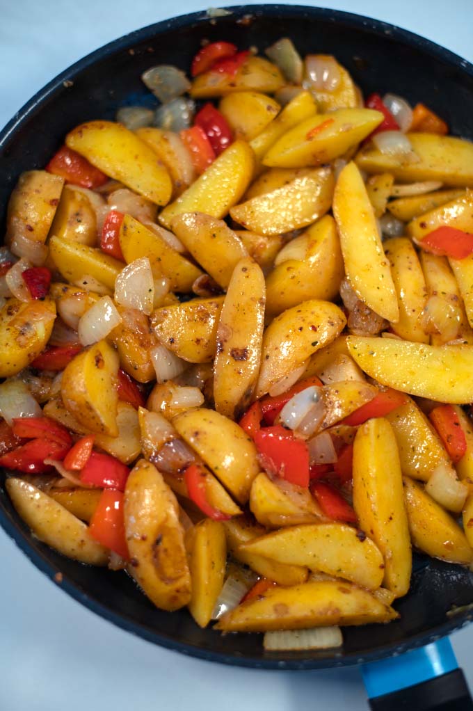 Closeup of Potatoes with Peppers and Onions.