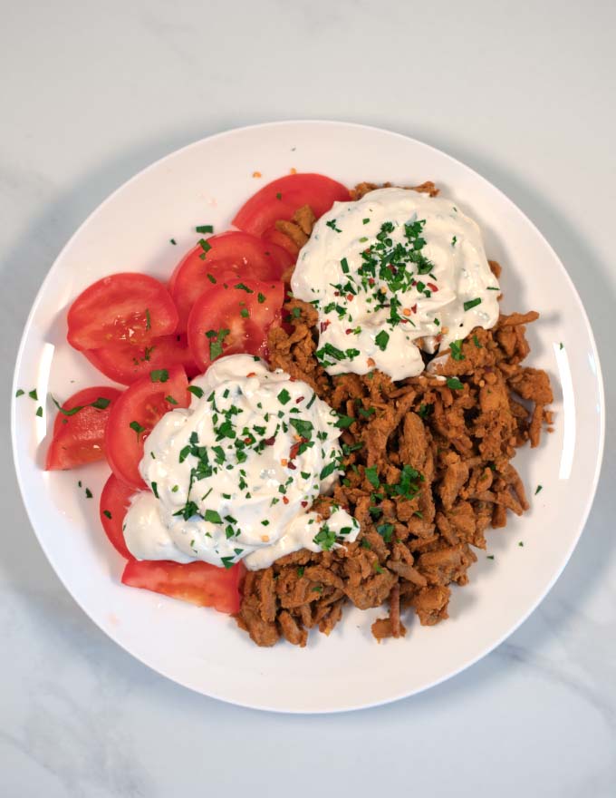 A serving of Shawarma with sauce.