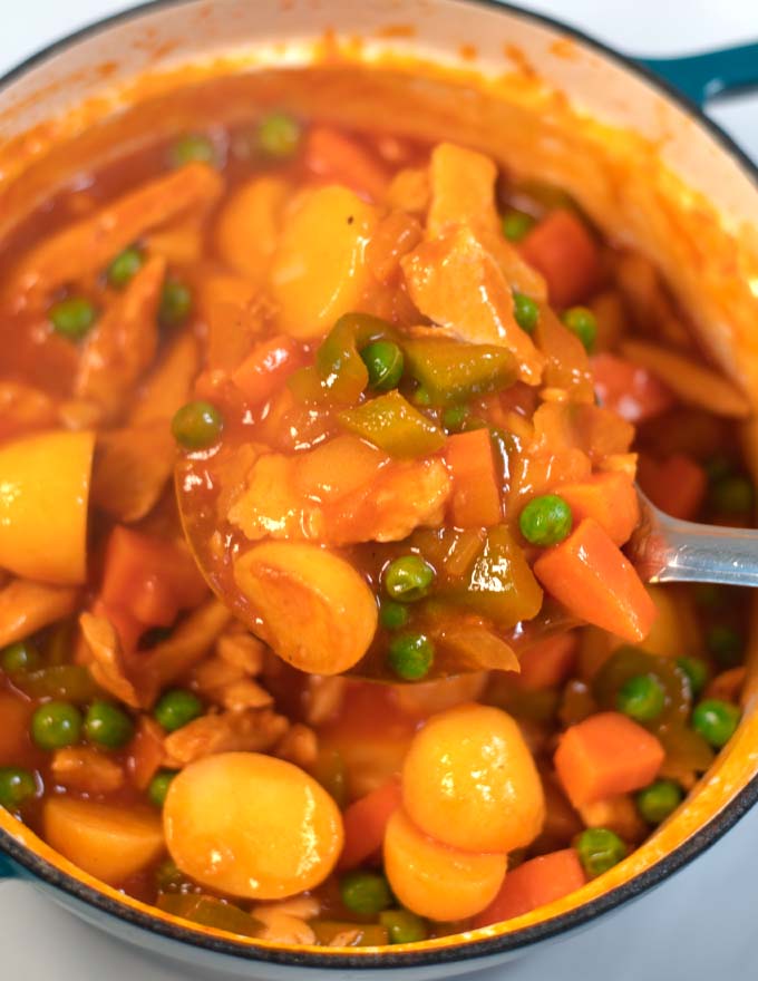 A large spoonful of Afritada Chicken.