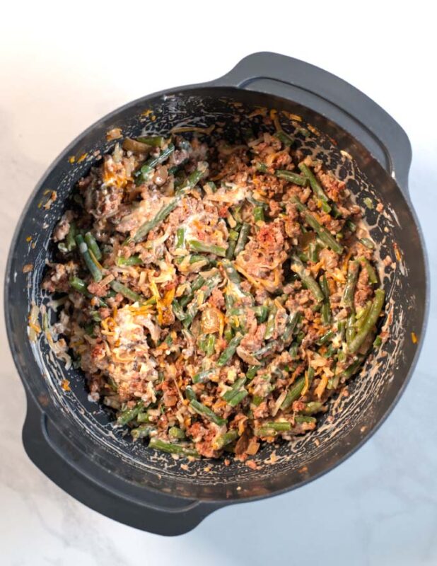 Well mixed filling of the Keto Green Bean Hamburger Casserole in a bowl.