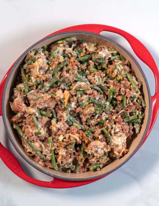 Keto Green Been Hamburger Casserole filling is transferred to a large baking dish.