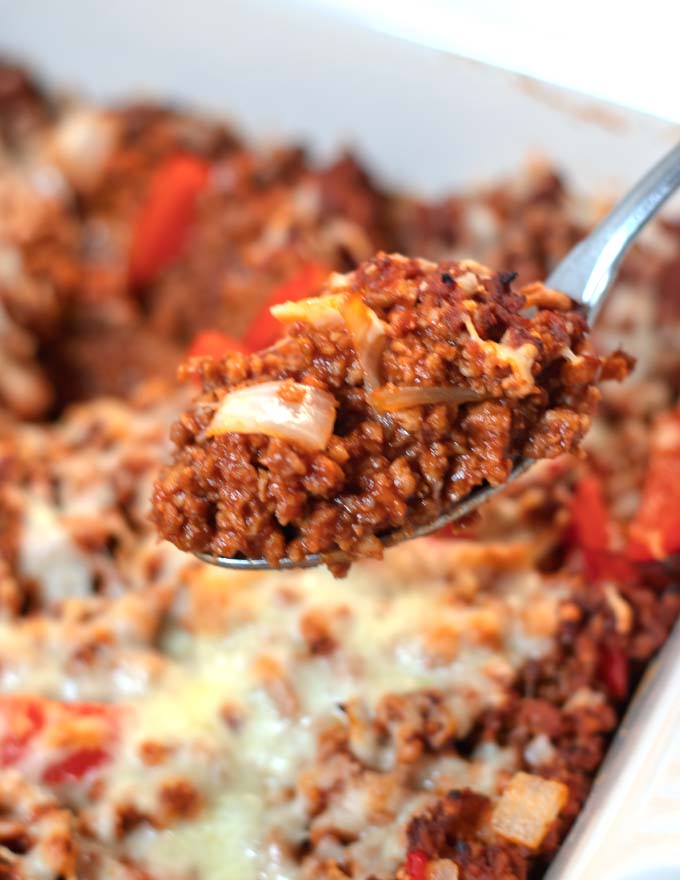 Closeup on a spoon full of Sloppy Joe Casserole.