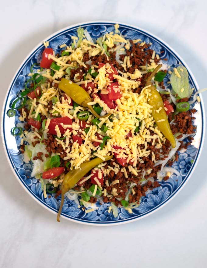 Finally green chilis and vegan cheese tops the Keto Taco Salad.