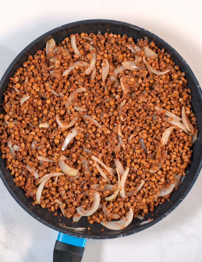 Lentils mixed with vegan ground beef and onions.