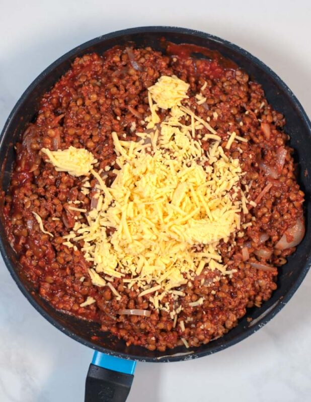 Dairy-free cheese is mixed with the Lentil Casserole filling.