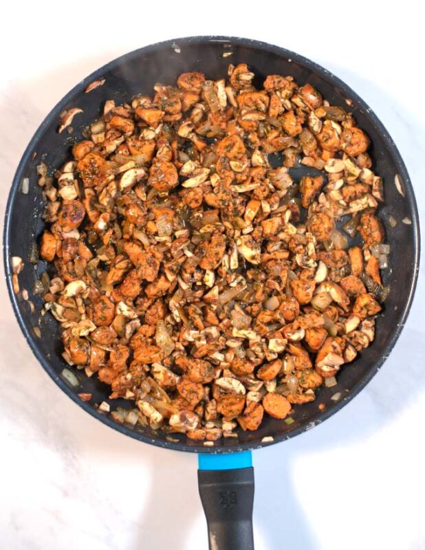 Ready sausage-mushroom mixture in a pan.