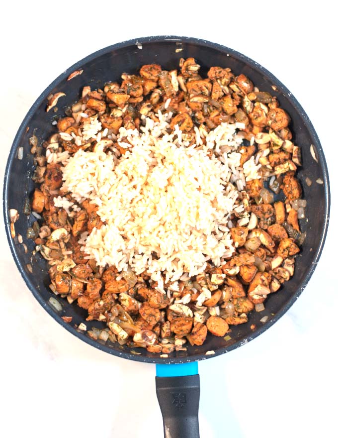 Cooked rice is given to the pan.