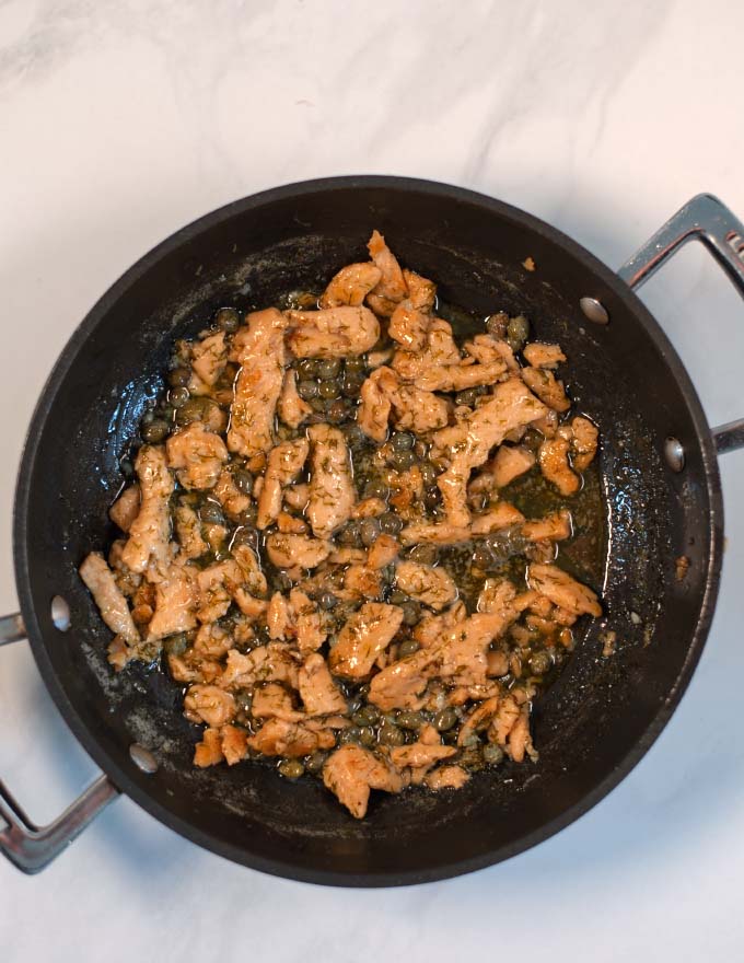 A serving of plant-based chicken with Lemon Caper Sauce.