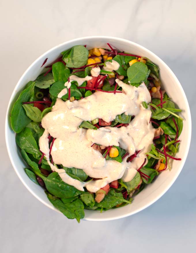 Dressing is given over the salad in the bowl.