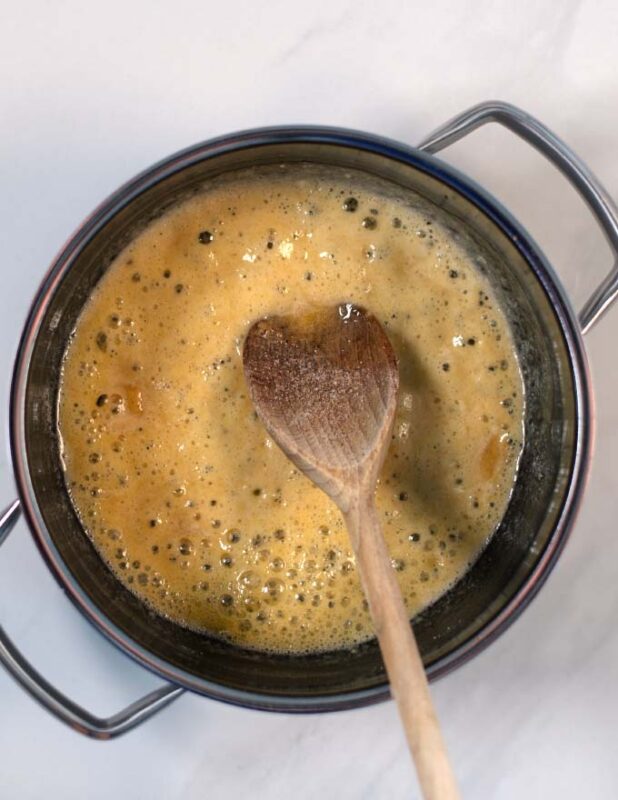 Bubblinf butter and flour as base for the roux.