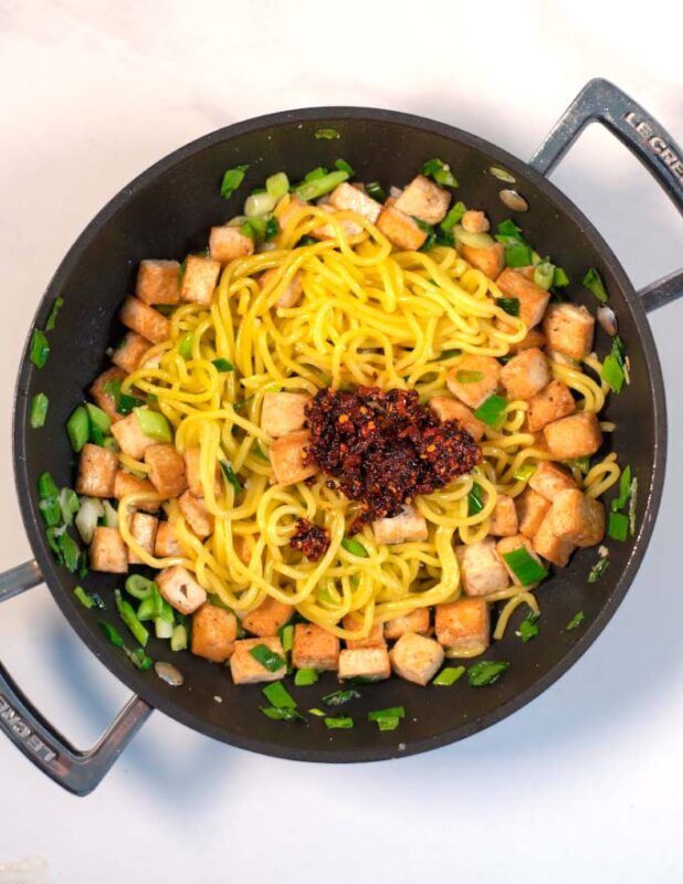 Sauce ingredients are given to the pan with the Fried Rice Noodles.