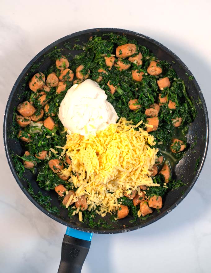 Vegan sour cream and cheese are mixed with the spinach and sausage.