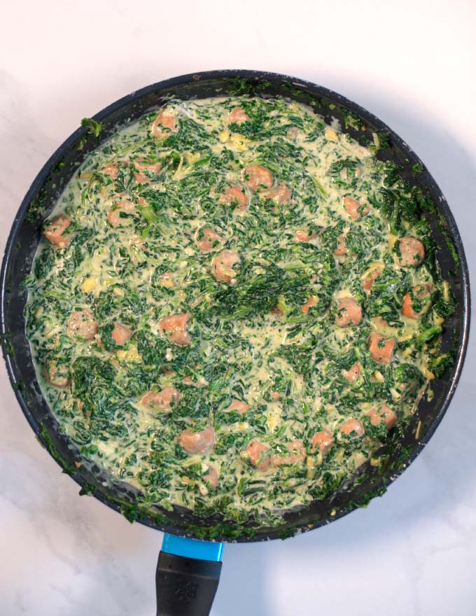 Top view of the ready creamy spinach and sausage mixture.