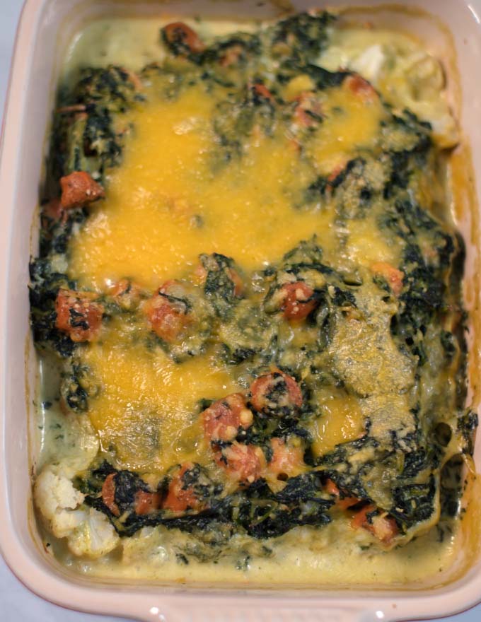 Closeup on the cheesy top of Cauliflower Sausage Casserole.