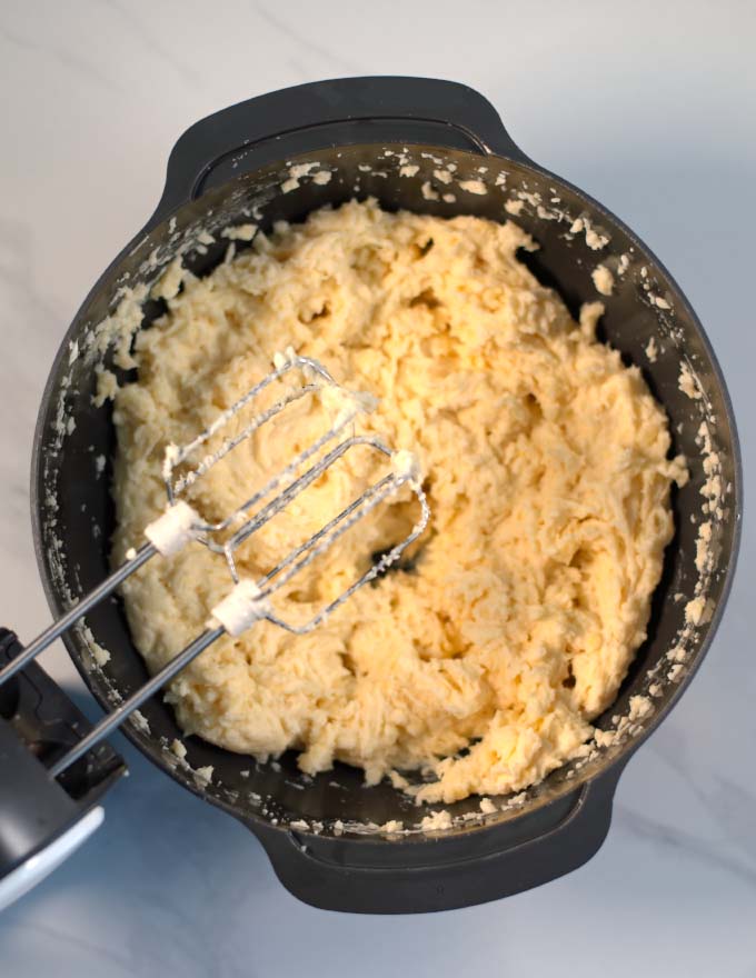 A hand mixer is used to mash potatoes and cauliflower.