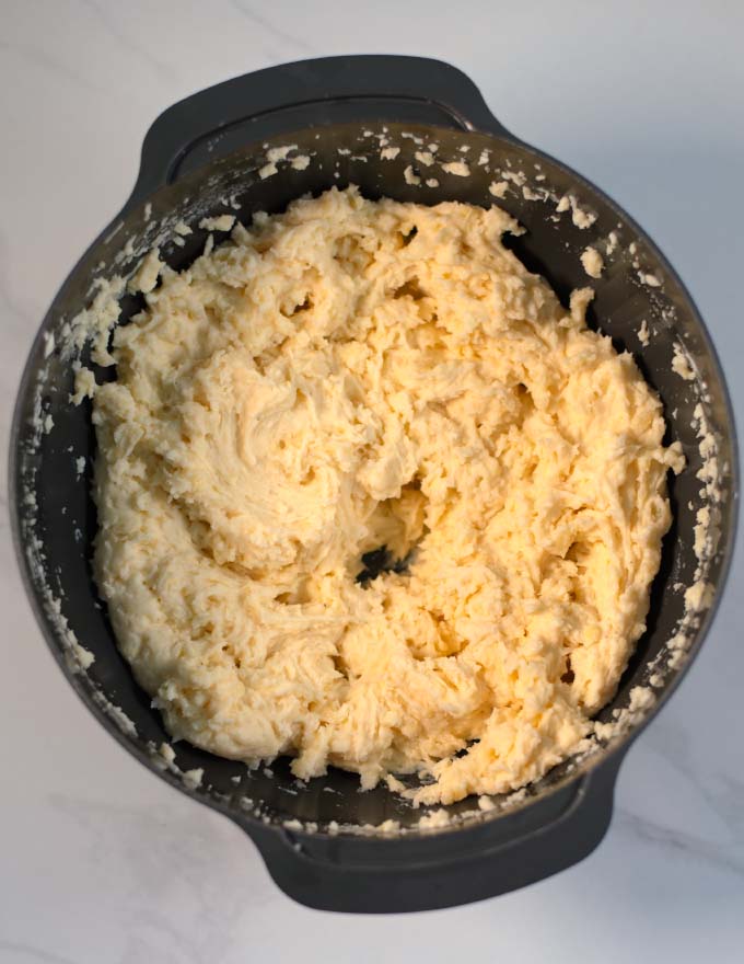 Large mixing bowl with the ready Mashed Potatoes and caulifower.